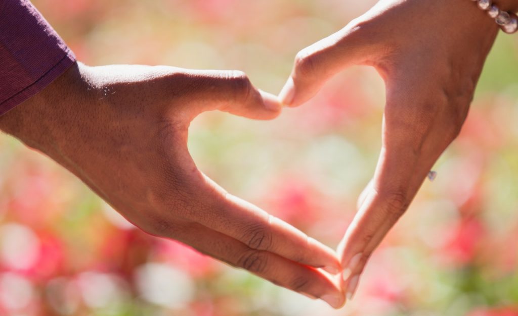 Couple holding hands in shape of heart for Wellness Psychological Services. We offer online marriage counseling in Florida. Contact an online couples counselor in Tampa Bay, FL or an online therapist in Florida for more info! 33609 | 33704 | 33703