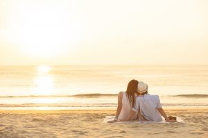 A couple sit together on the beach as they watch the sun set. Contact a marriage counselor in Tampa, FL to learn more about marriage counseling in Saint Petersburg, FL and other services. A couples therapist in Saint Petersburg, FL can help you today! 33609 | 33704 | 337703