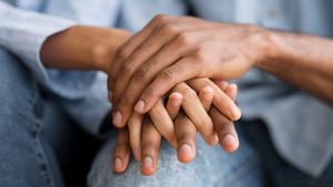 A close up of a couple holding hands for Wellness Psychological Services. Contact a couples therapist to learn more about couples therapy and marriage counseling in Tampa, FL. 33609 | 33704 | 337703