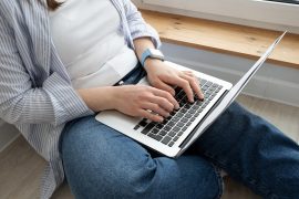 A close up of a person typing on their laptop. Learn how online eating disorder therapy in Tampa, FL can offer support by contacting an eating disorder therapist in St. Pete, FL today.